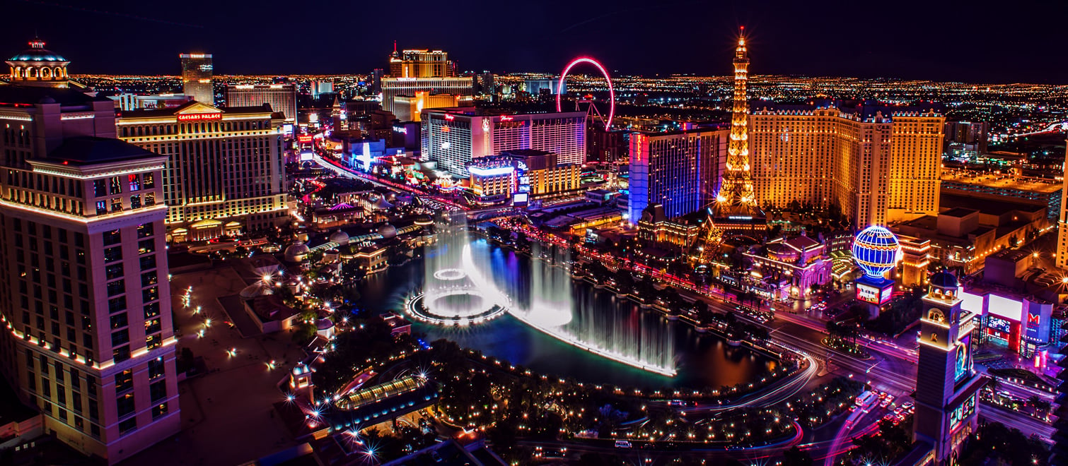 A night time shot of some popular casinos on the Las Vegas strip