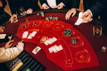 Casino dealer dealing cards and chips